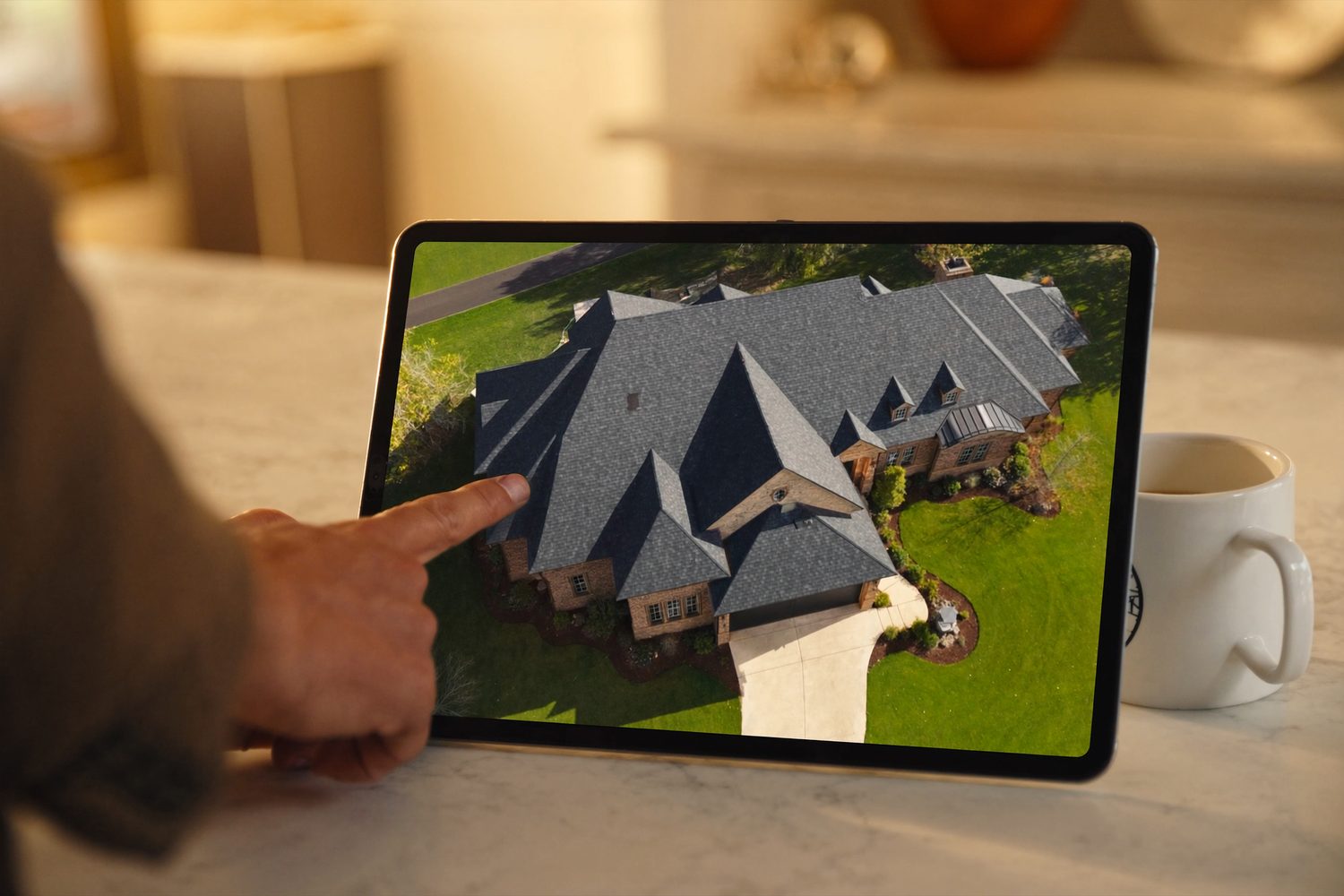 Your roof's aerial photos, reviewed together on a tablet