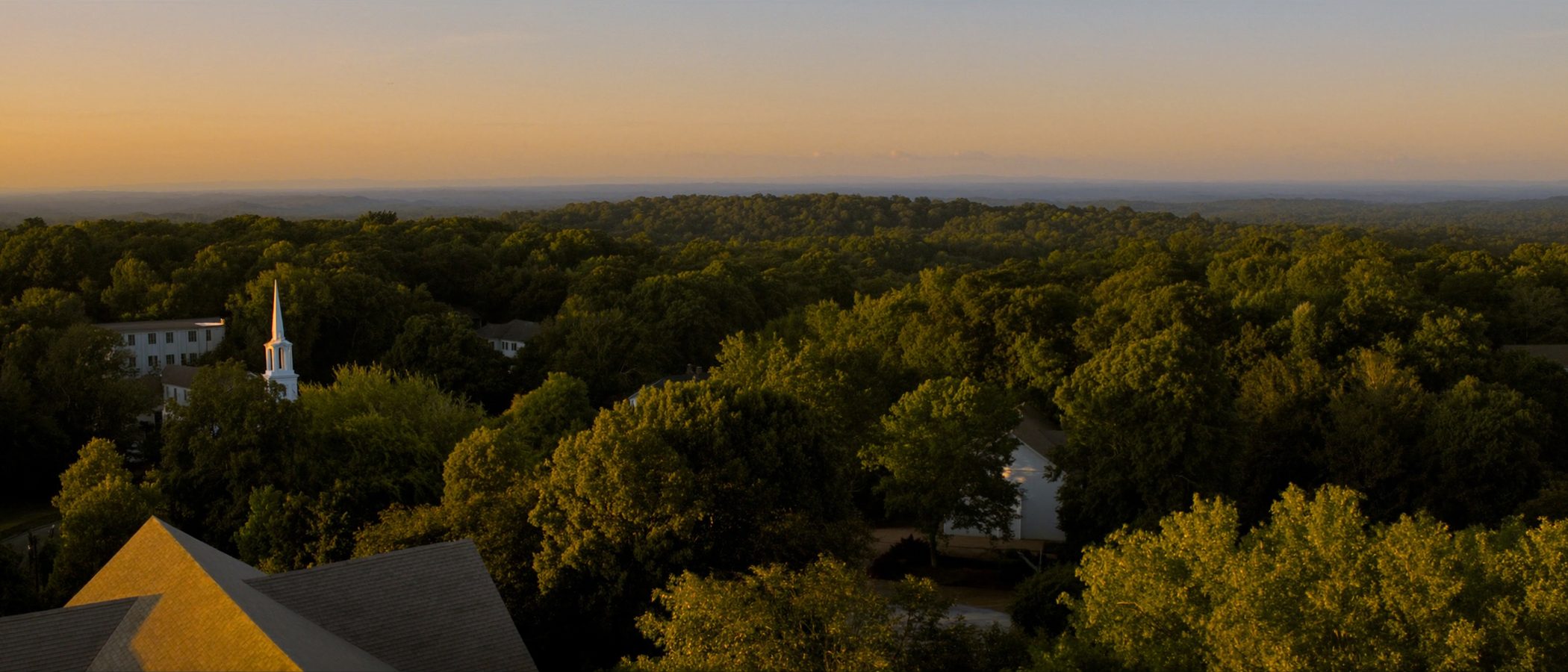 Aerial view of Piedmont Triad neighborhoods at golden hour