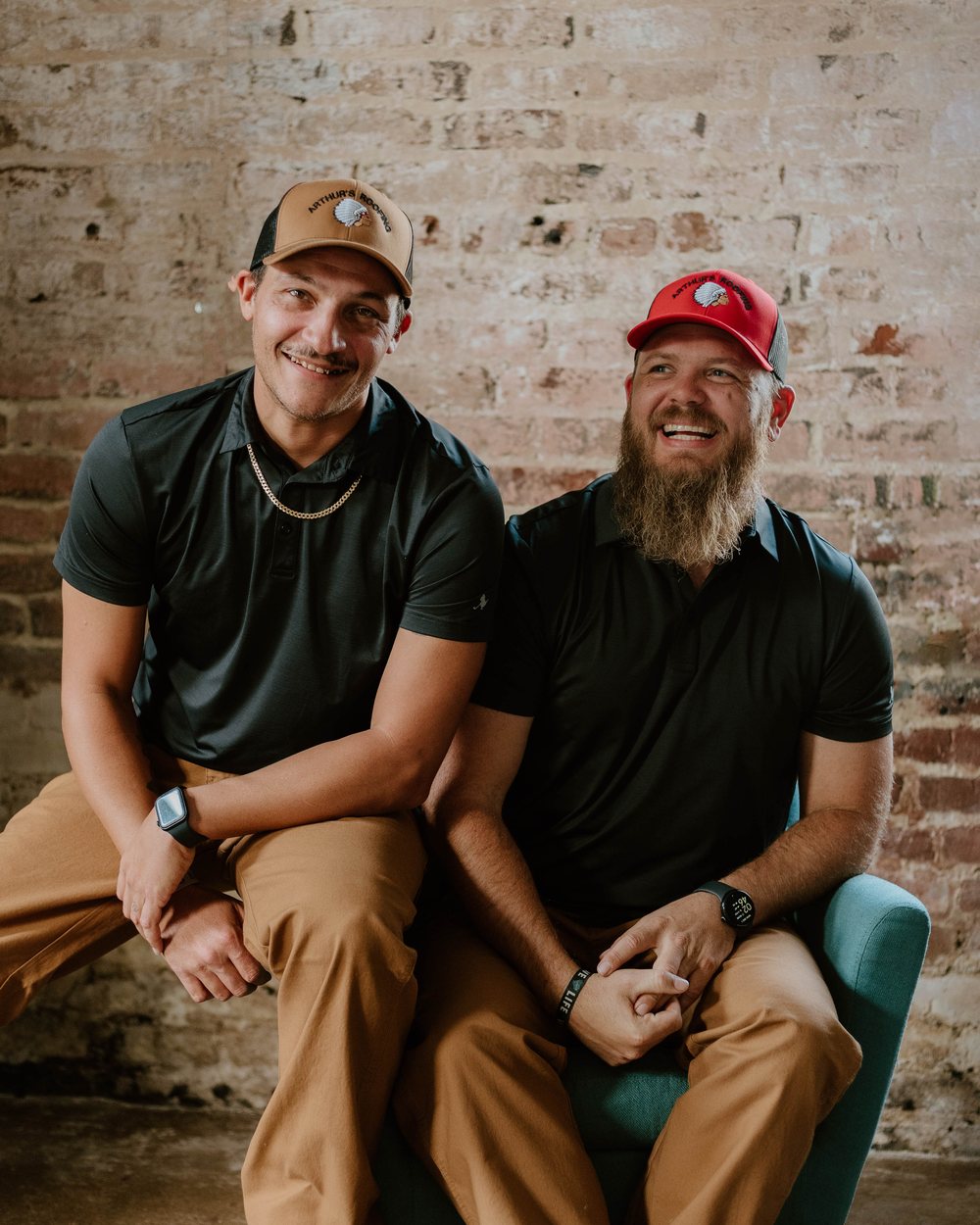 Arthur's Roofing crew members sharing a laugh